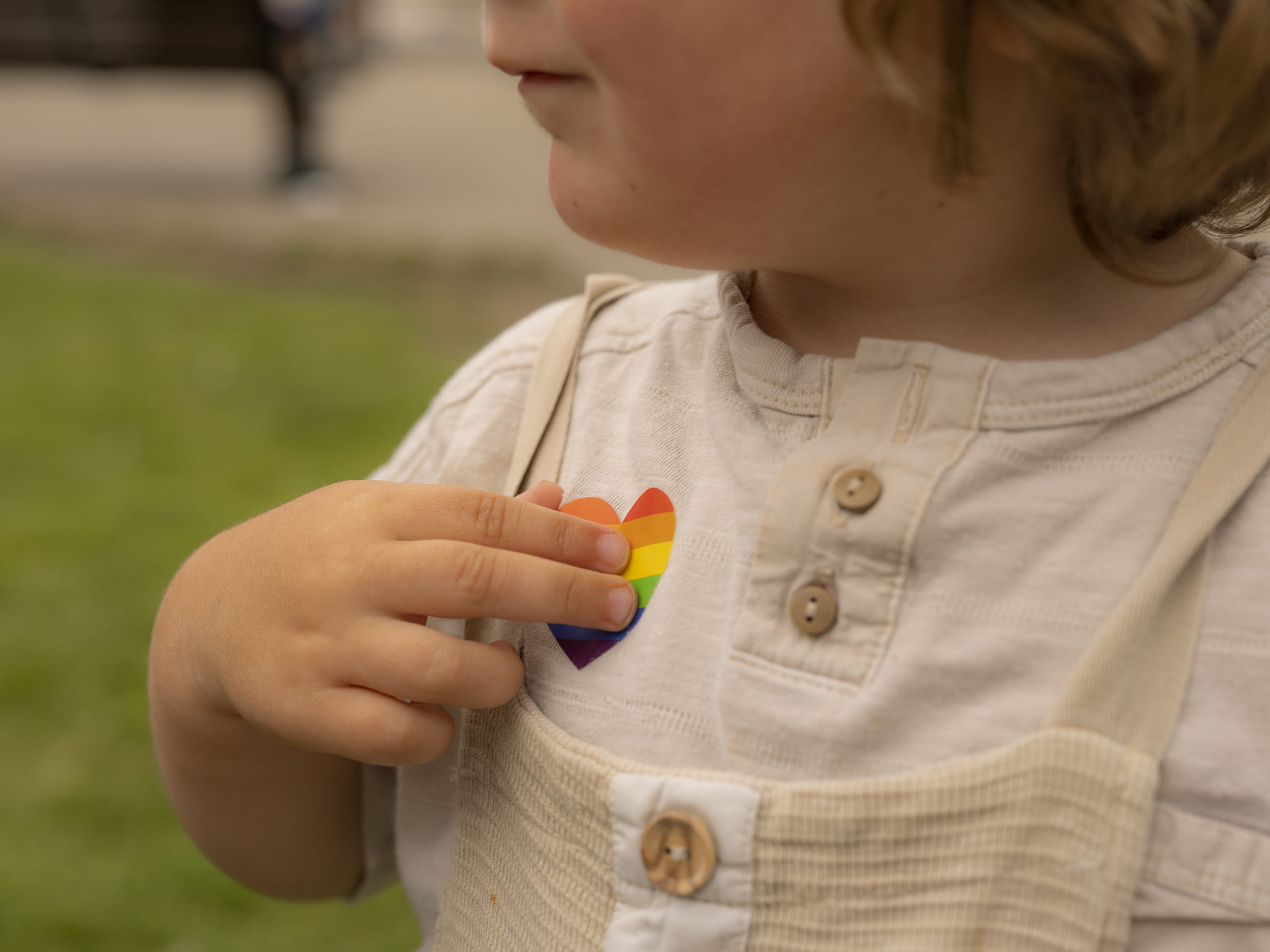 child with rainbow sticker (Ben Hughes)