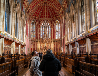 St. Cuthbert's Chapel with visitors in foreground